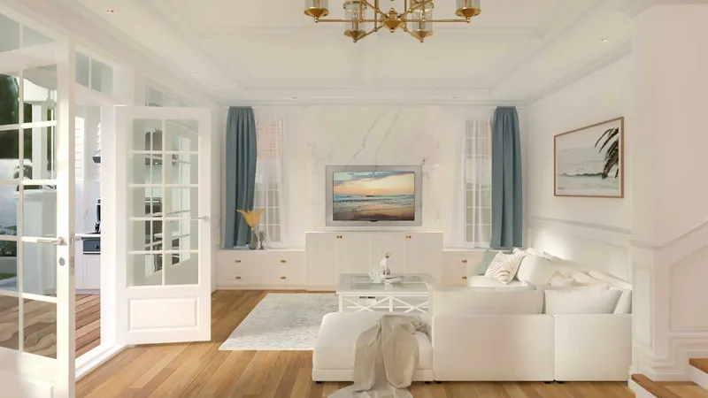 Luxury contemporary Hampton's interior living room with crisp white walls, custom cabinetry, timber floor boards, wainscoting, coastal blue and luxe gold accents.
