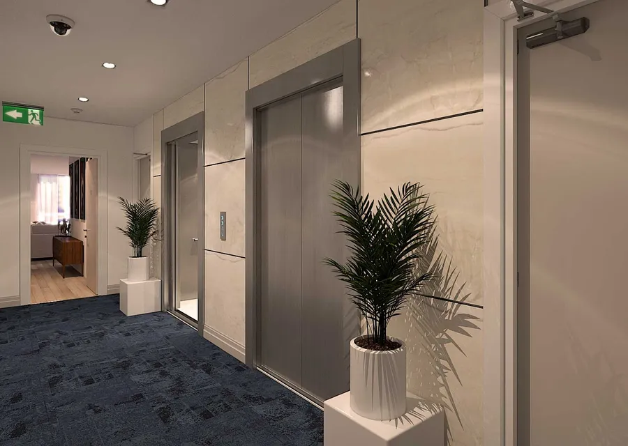 Lift lobby with sandy-toned porcelain paneling and navy blue textured carpet, reflecting the coastal charm of Broadbeach.