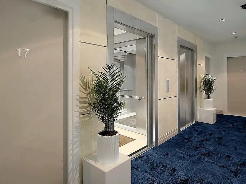 An elevator lobby in Boulevard Towers with a nautical themed design, featuring a blue carpet