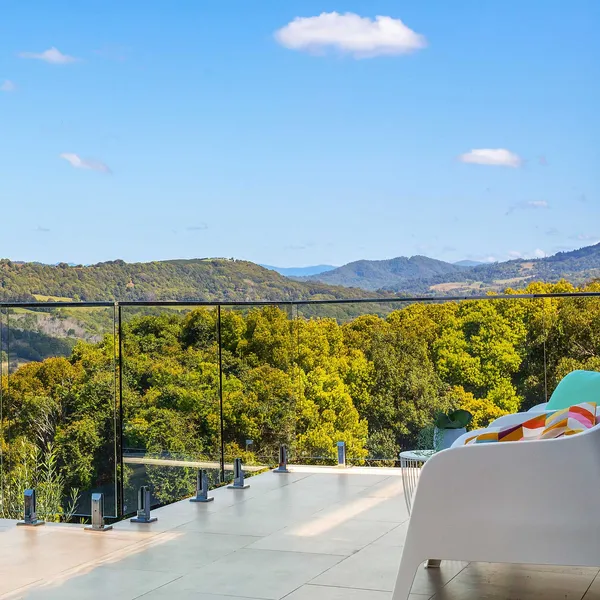 Three-level Cote D'Azur inspired home with panoramic views of the valley, meticulously designed to fit a steep site