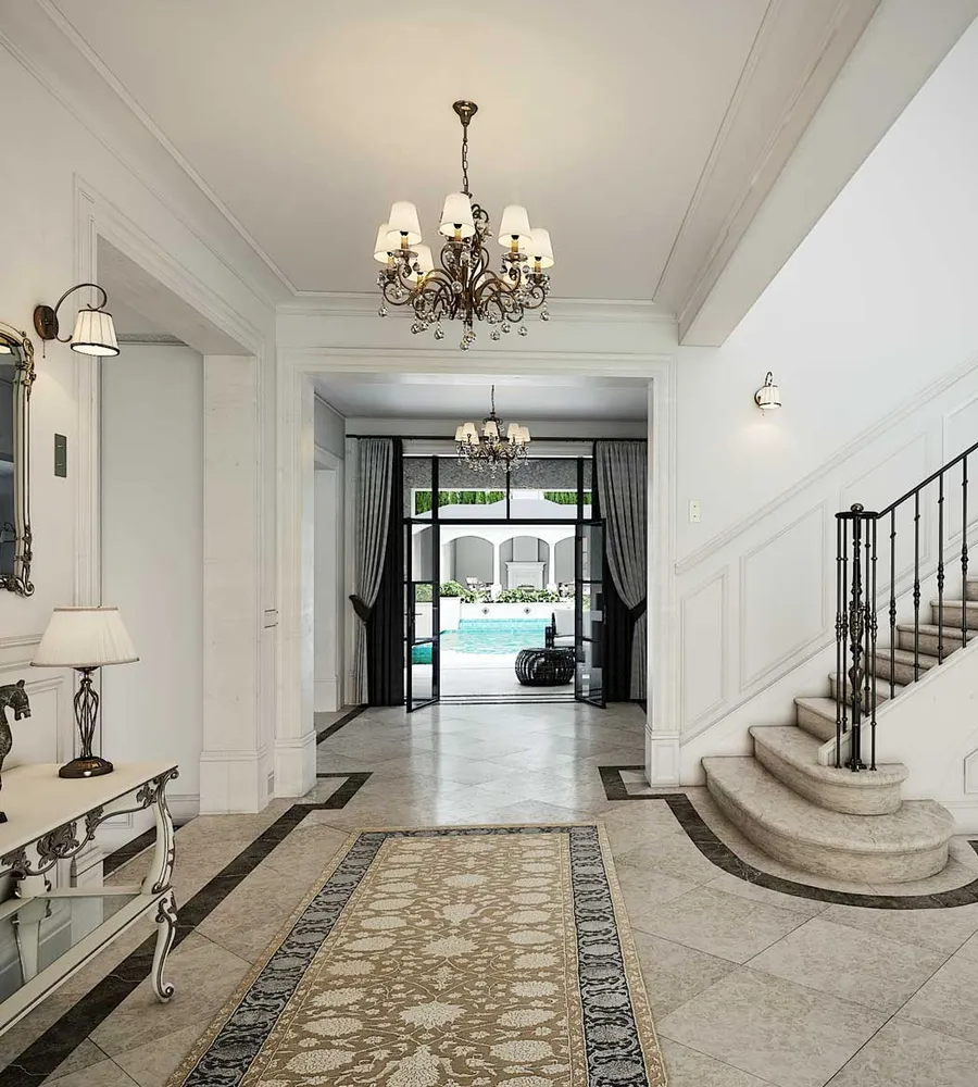 Entrance view of Classic Elegance showcasing a majestic marble staircase and a direct sightline to the pool and pool house.