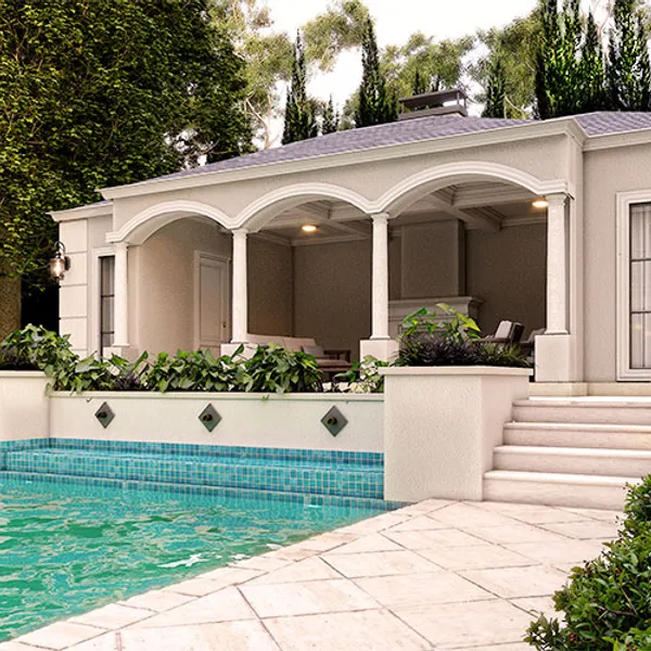 Detailed view of the French Provincial style pool house, highlighting the intricate columns, arches, and quoining that add to the project's overall opulence.