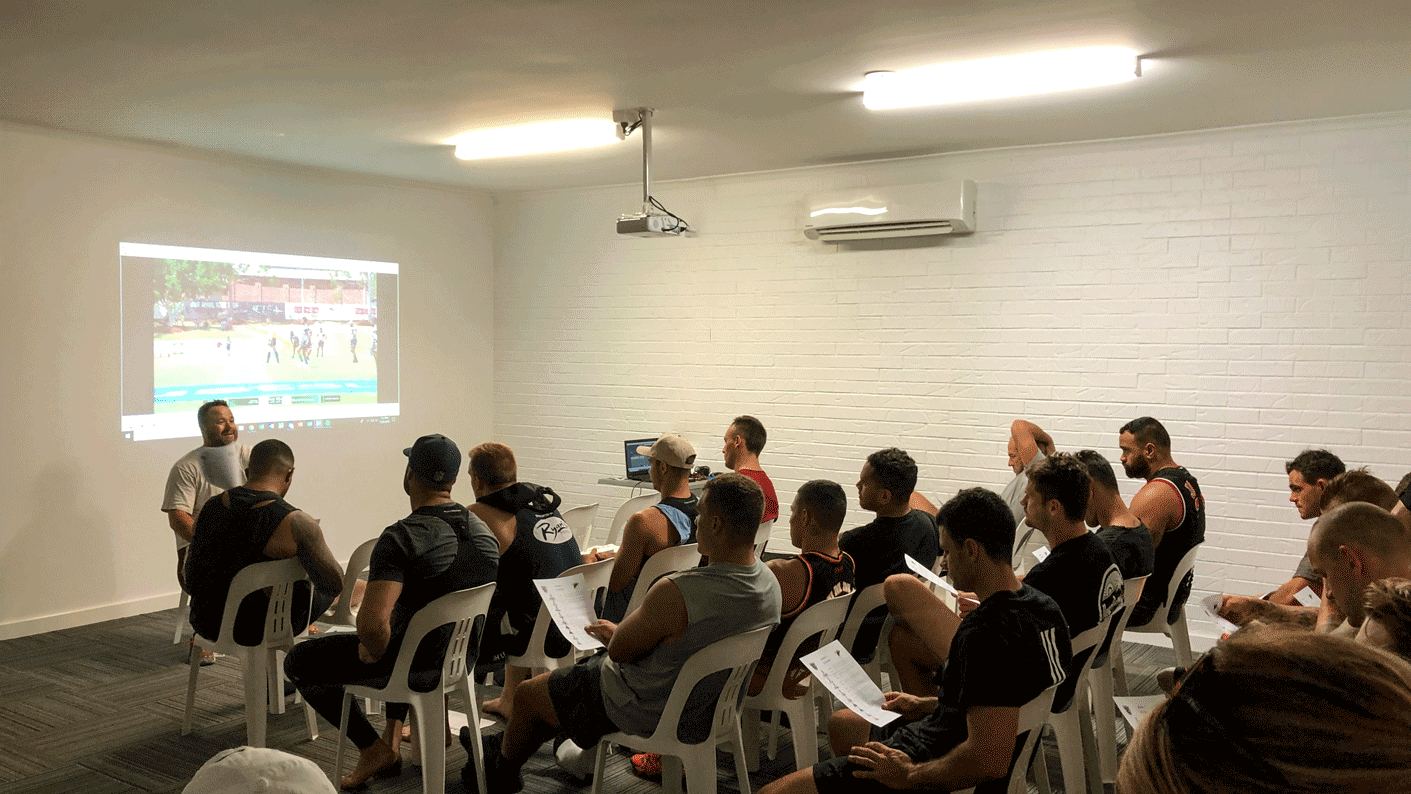 An engaging sports development session taking place in a modern facility, showcasing meticulous attention to detail and a contemporary urban aesthetic.