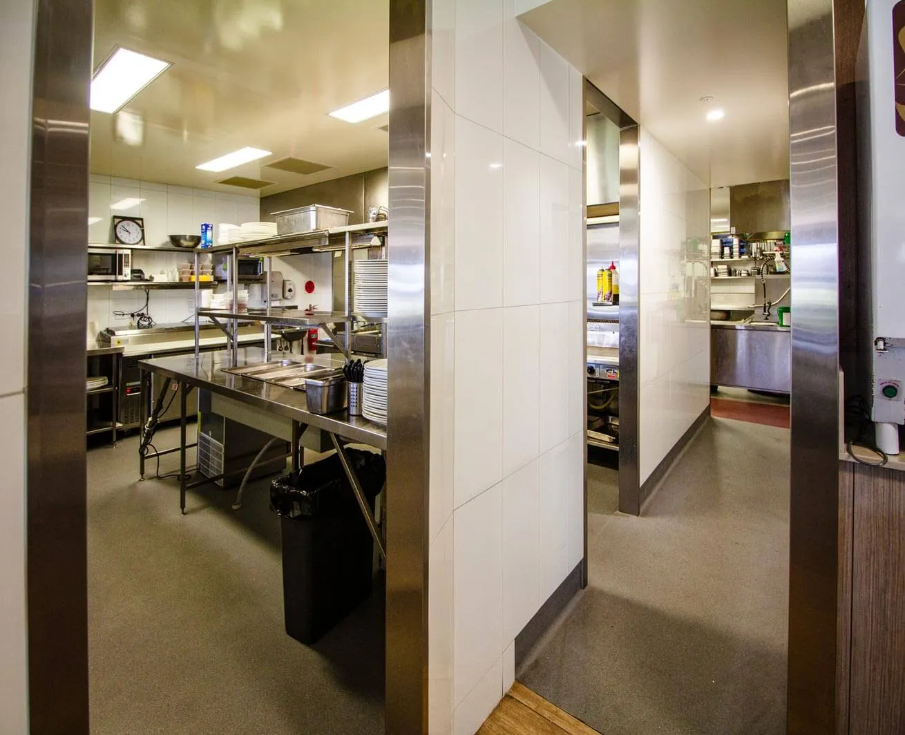 Refurbished commercial kitchen at Burleigh Leagues Club designed by Gold Coast architects