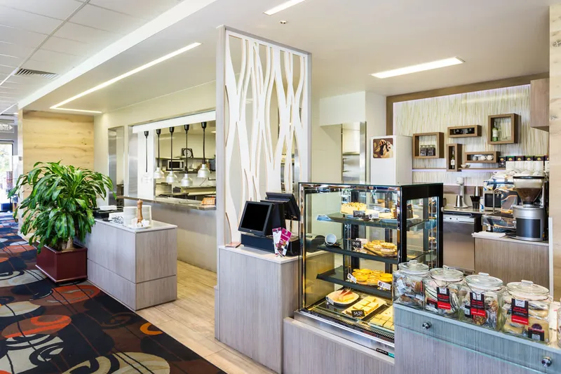 Burleigh Leagues Kitchen - Clean stainless steel preparation benches and shelving