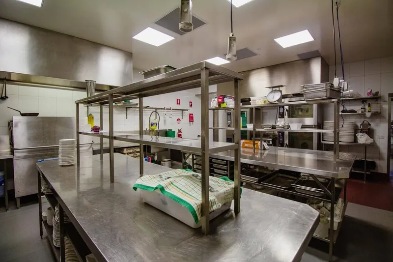 Burleigh Leagues Kitchen - Dedicated commercial dishwashing area with pass-through machine
