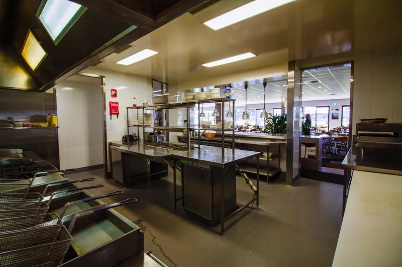 Burleigh Leagues Kitchen - Organised dry goods storage area with wire shelving