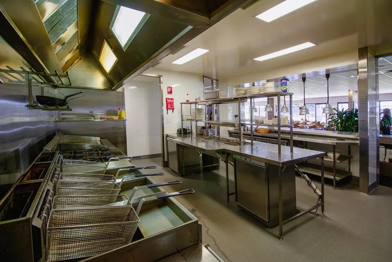 Burleigh Leagues Kitchen - Front-of-house servery counter showing food display and POS area