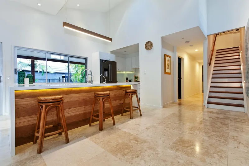 Lake View House Renovation - Open concept kitchen with waterfront views and premium appliances