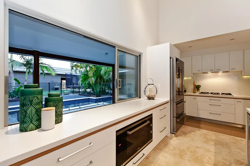 Lake View House Renovation - Outdoor entertaining area with integrated BBQ and dining space