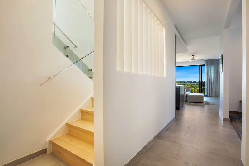 Architectural detail showing the interplay of off-form concrete and natural timber cladding