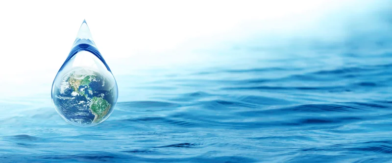 Symbolic image of planet Earth within a clear water drop.