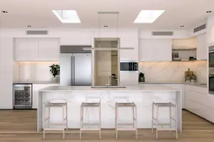 Modern kitchen showing distinct zones for cooking, prep, and storage.