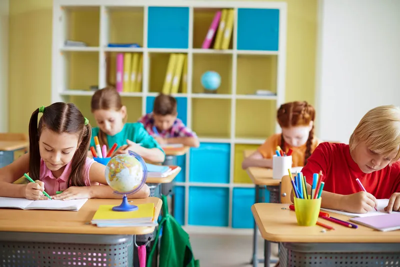 Color zoning in an open-plan Gold Coast Queensland school showing how different hues are used to separate functional areas while maintaining spatial flow.