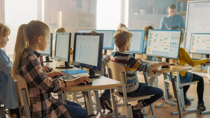 Students working with AI tools in a well-designed Gold Coast Queensland learning space that balances technology with human connection.