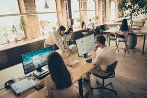 Modern hybrid workspace design with collaborative areas and technology integration for Gold Coast businesses.