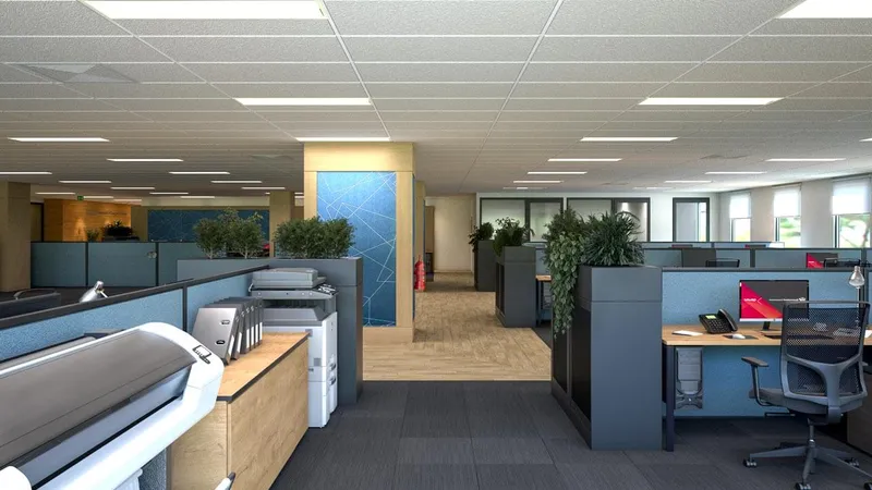 Print and workstation zone with open desks, acoustic panels, and indoor planting at QBuild's South Coast Offices.
